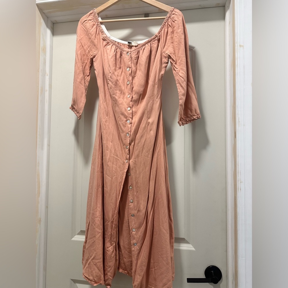 Cute dress. Button down, mocked back detail.